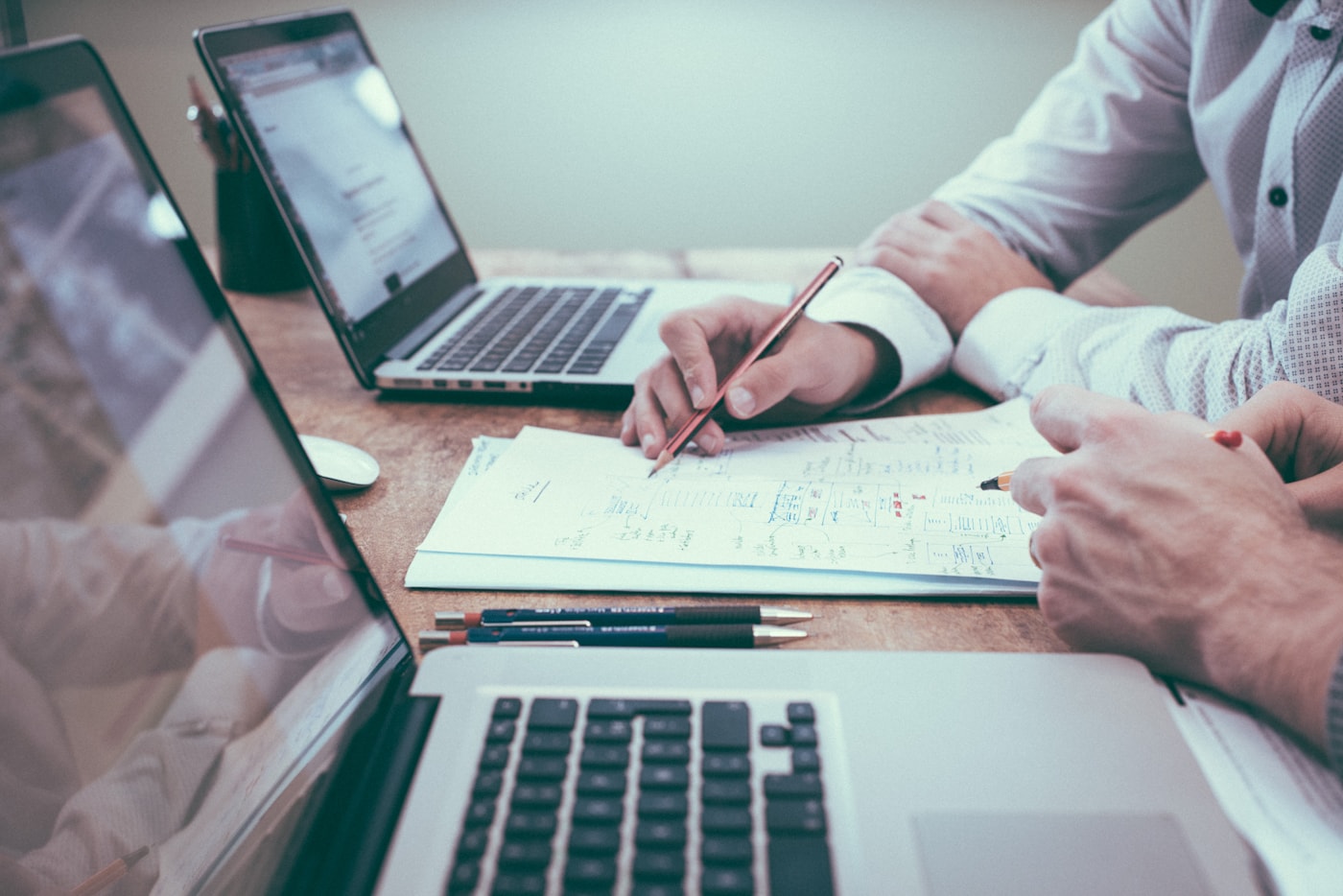 Financial professionals reviewing business data